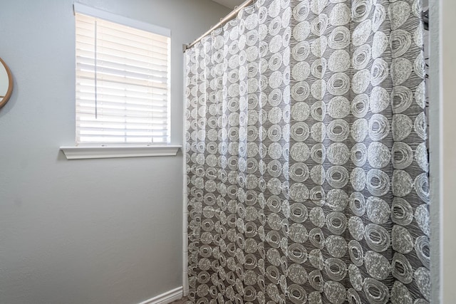 bathroom featuring a shower with curtain