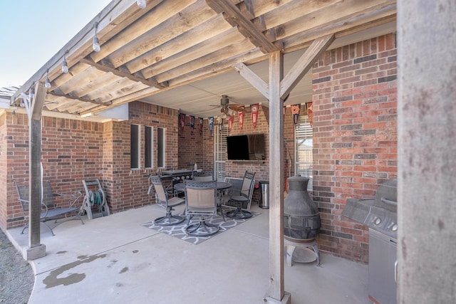 view of patio / terrace with ceiling fan and outdoor dining area