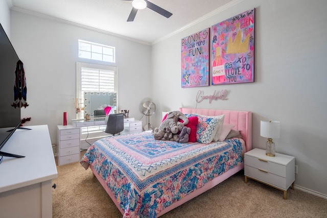 carpeted bedroom featuring ornamental molding and a ceiling fan