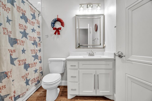 602 Frank Davis Ave, Coahoma, TX 79720 - laundry area featuring washing machine and clothes dryer, cabinet space, and wood finished floors