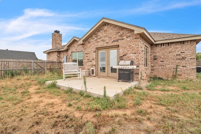 602 Frank Davis Ave, Coahoma, TX 79720 - rear view of house with a chimney and brick siding