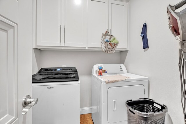 602 Frank Davis Ave, Coahoma, TX 79720 - laundry room with independent washer and dryer, cabinet space, and wood finished floors