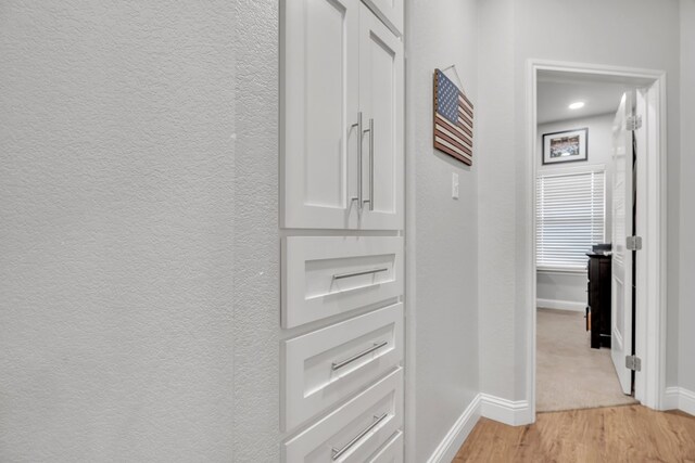 602 Frank Davis Ave, Coahoma, TX 79720 - hallway featuring baseboards and light wood-style flooring