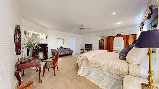 bedroom featuring ceiling fan and light colored carpet