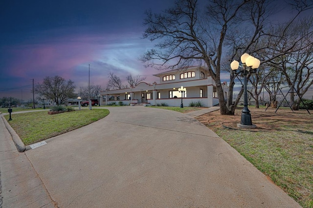 view of front of property with a lawn