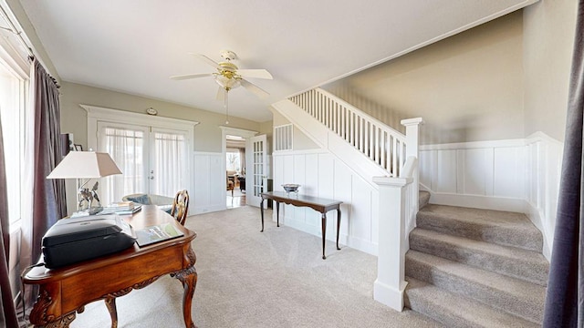 interior space featuring carpet flooring, ceiling fan, and french doors