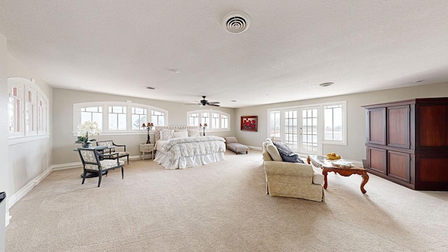 carpeted bedroom featuring a textured ceiling