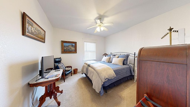 bedroom with ceiling fan and light colored carpet