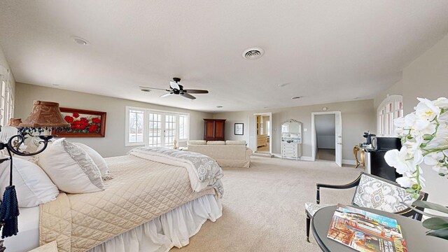 bedroom featuring ceiling fan and light colored carpet