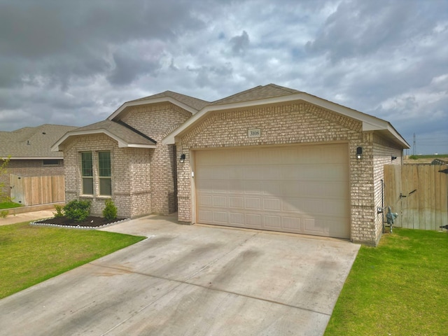 3108 Mearns Ct, Midland, TX 79705 - view of front of home with brick siding, driveway, an attached garage, and roof with shingles