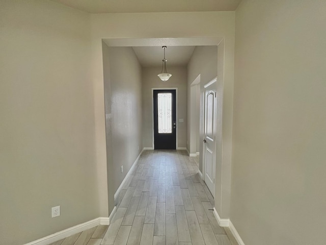 3108 Mearns Ct, Midland, TX 79705 - doorway to outside with baseboards and light wood-style flooring