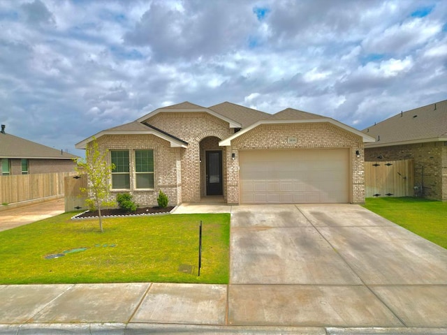 3108 Mearns Ct, Midland, TX 79705 - view of front facade featuring brick siding, an attached garage, and driveway