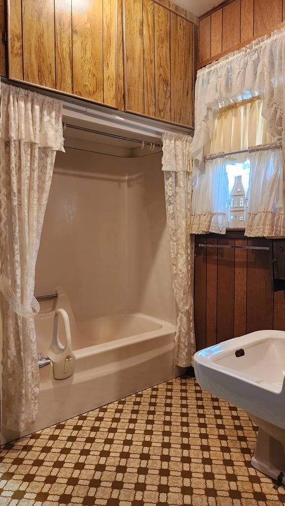 bathroom featuring a tub to relax in