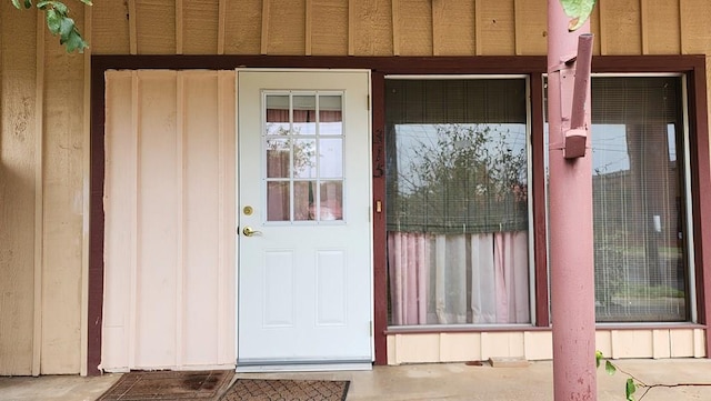 property entrance with board and batten siding