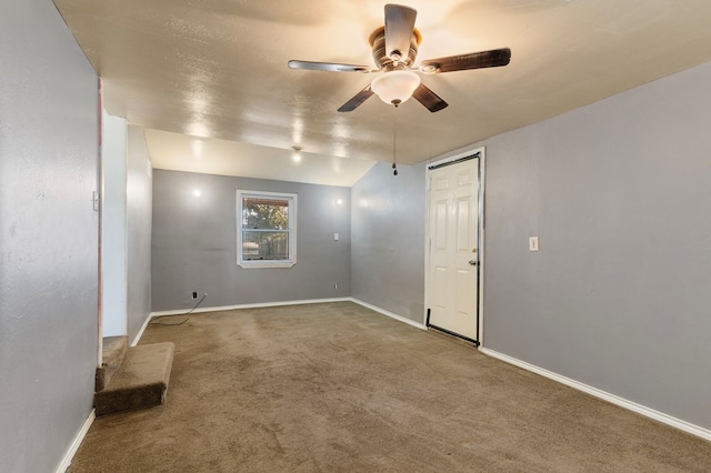 carpeted empty room with ceiling fan