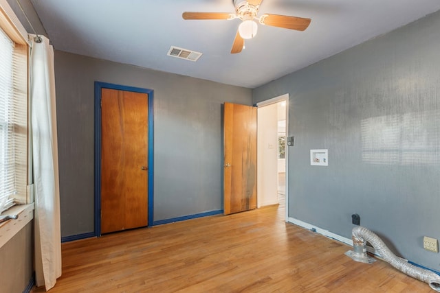 unfurnished bedroom with a closet, ceiling fan, and light hardwood / wood-style flooring