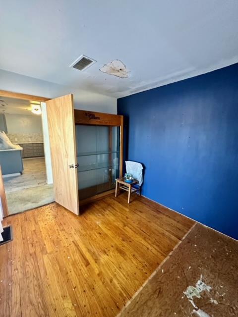 unfurnished bedroom featuring wood-type flooring