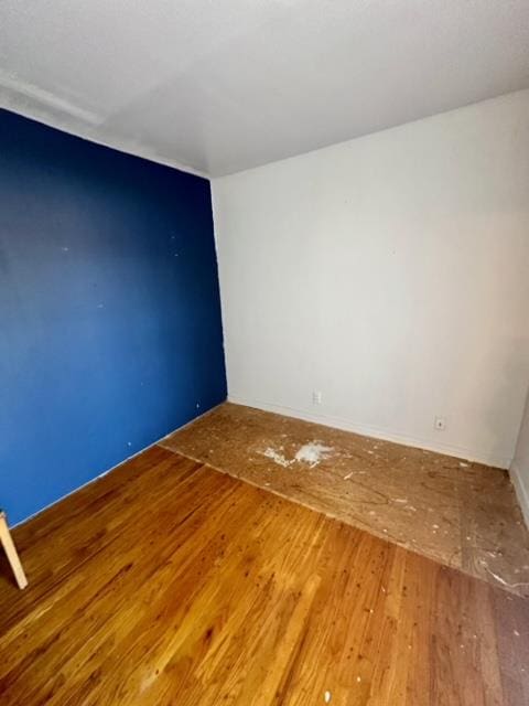 spare room featuring hardwood / wood-style floors