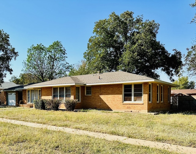 ranch-style home featuring a garage