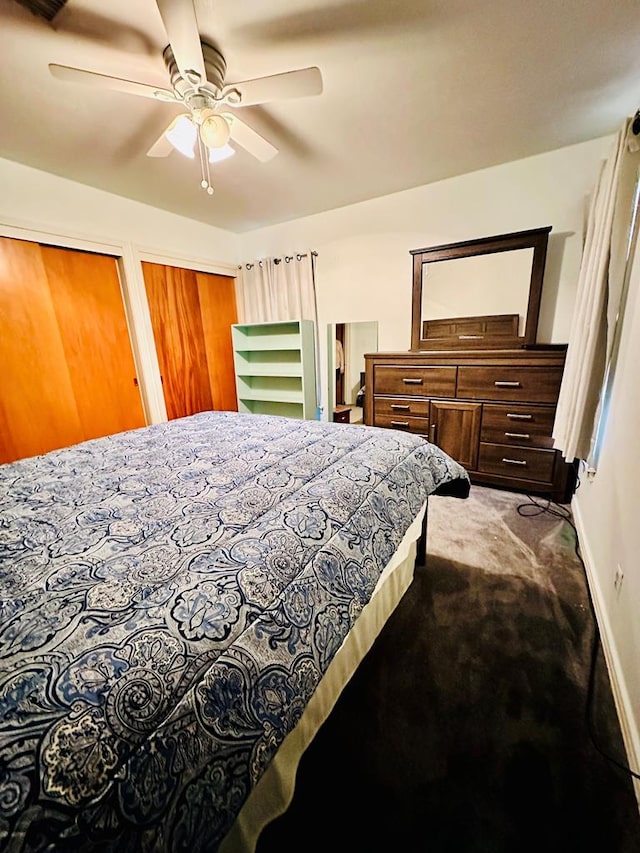 bedroom with multiple closets, ceiling fan, and carpet