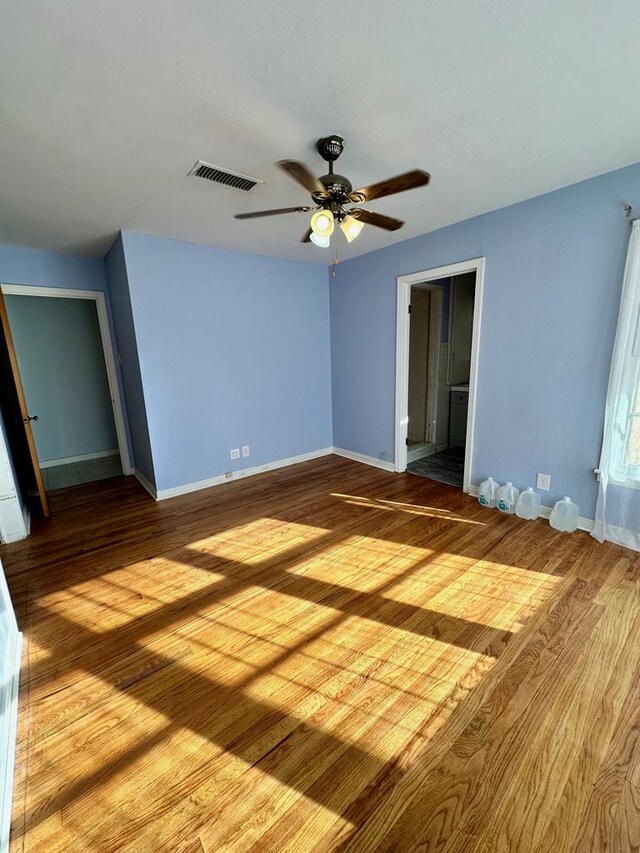 spare room featuring ceiling fan and light hardwood / wood-style floors