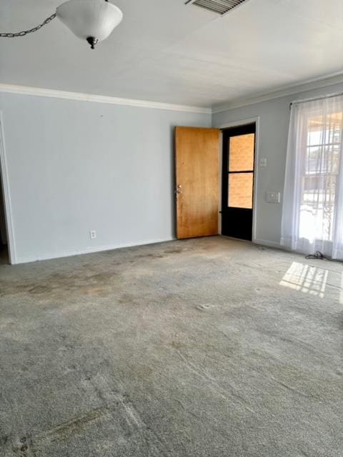 carpeted spare room with crown molding