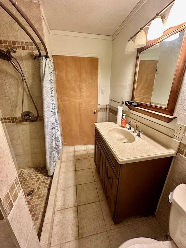 bathroom featuring curtained shower, tile patterned flooring, crown molding, toilet, and vanity