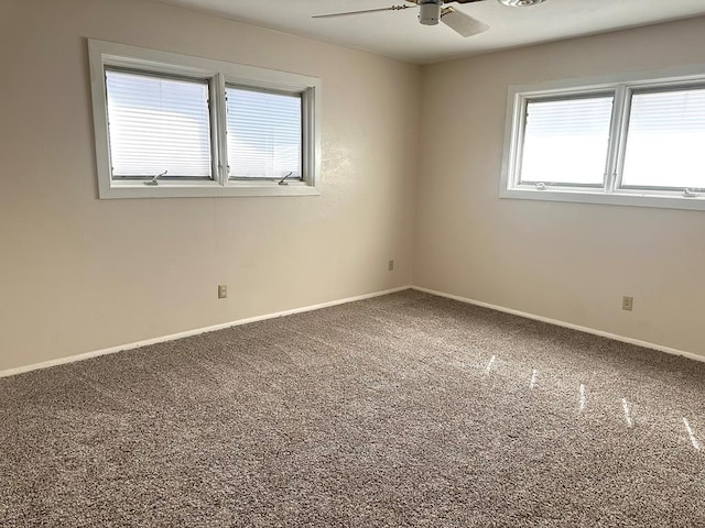 unfurnished room featuring ceiling fan, baseboards, and carpet flooring