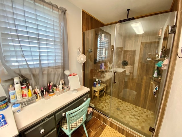 bathroom featuring a shower with door