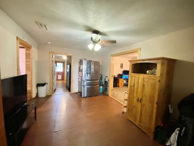 living room featuring hardwood / wood-style floors and ceiling fan