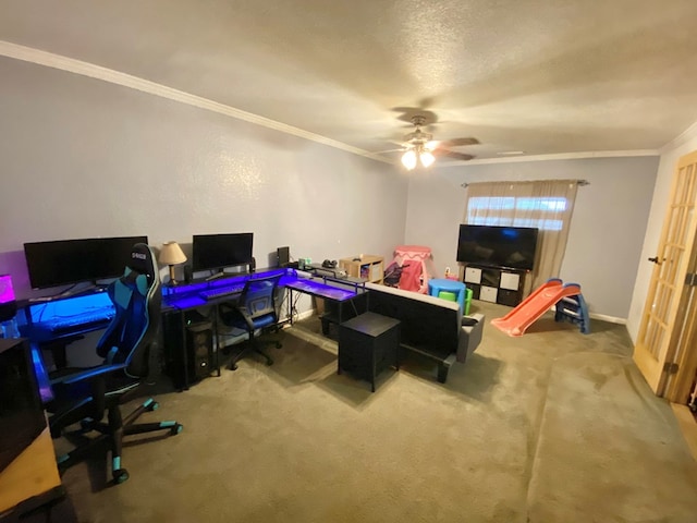 carpeted home office with a textured ceiling, ceiling fan, and crown molding