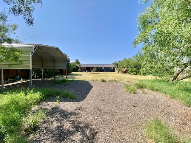 view of yard with a carport