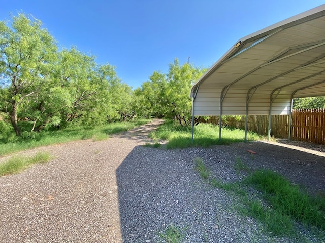 view of parking / parking lot with a carport