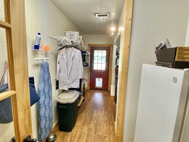 910 Culp Ave, Coahoma, TX 79511 - washroom featuring wood finished floors and a textured wall