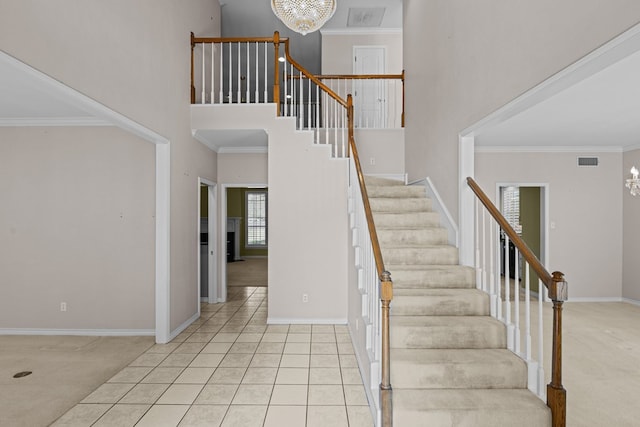 5708 Ridgemont Pl, Midland, TX 79707 - stairs featuring a high ceiling, carpet flooring, a chandelier, and crown molding