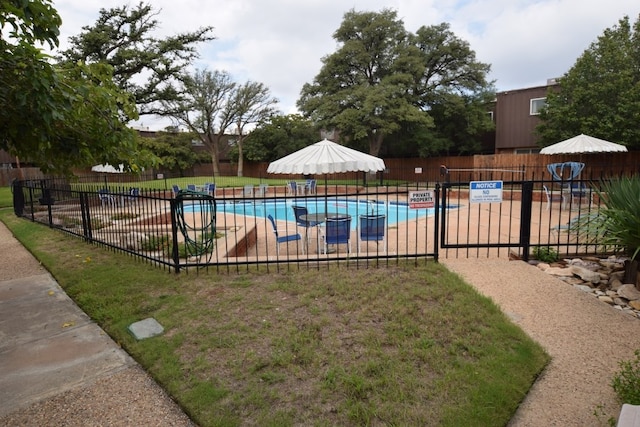 3000 W Illinois Ave Unit 24, Midland, TX 79701 - community pool featuring fence and a patio area
