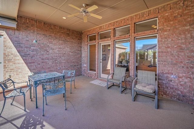 view of patio / terrace featuring ceiling fan