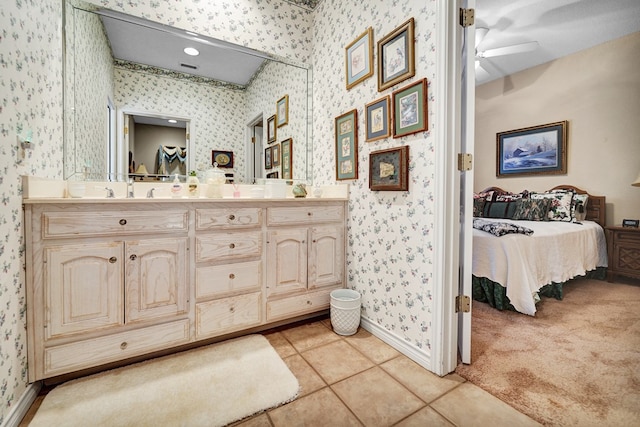 bathroom with ceiling fan, vanity, and tile patterned flooring