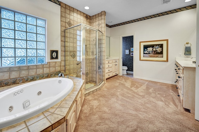 full bathroom featuring independent shower and bath, vanity, and toilet