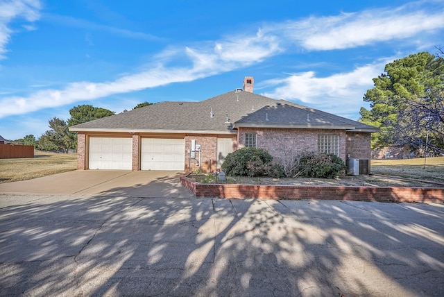 view of side of property with a garage