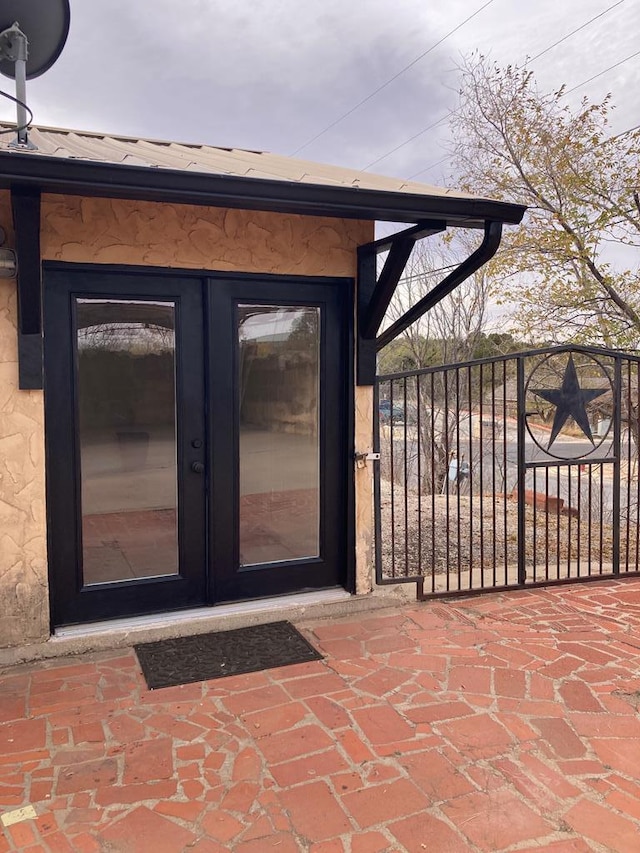 property entrance featuring french doors