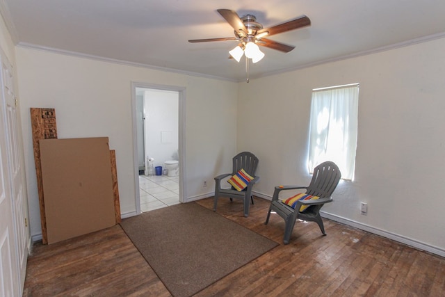 sitting room featuring ceiling fan, hardwood / wood-style floors, and crown molding