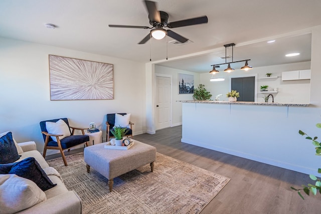 4604 Versailles Dr, Midland, TX 79703 - living area with wood finished floors and a ceiling fan