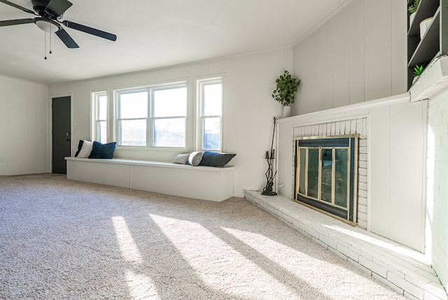 4604 Versailles Dr, Midland, TX 79703 - living area featuring carpet floors, ceiling fan, a fireplace, and ornamental molding