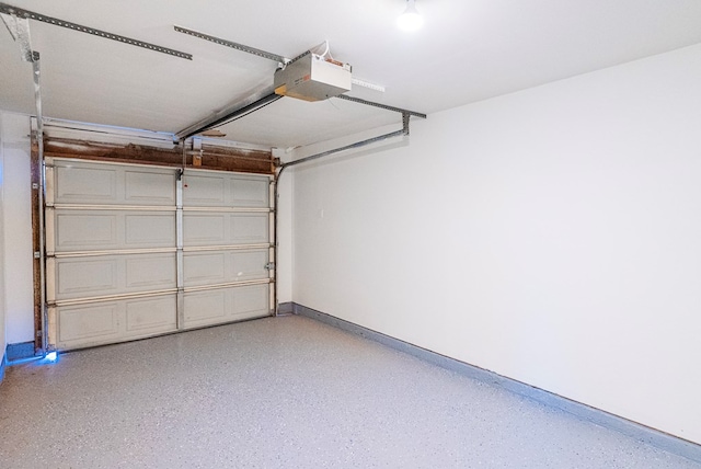 4604 Versailles Dr, Midland, TX 79703 - garage featuring a garage door opener and baseboards