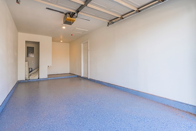 4604 Versailles Dr, Midland, TX 79703 - garage featuring a garage door opener and baseboards