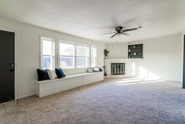4604 Versailles Dr, Midland, TX 79703 - carpeted living room featuring a brick fireplace and a ceiling fan