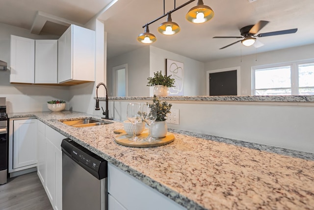 4604 Versailles Dr, Midland, TX 79703 - kitchen featuring dishwasher, ceiling fan, white cabinets, light stone counters, and wood finished floors