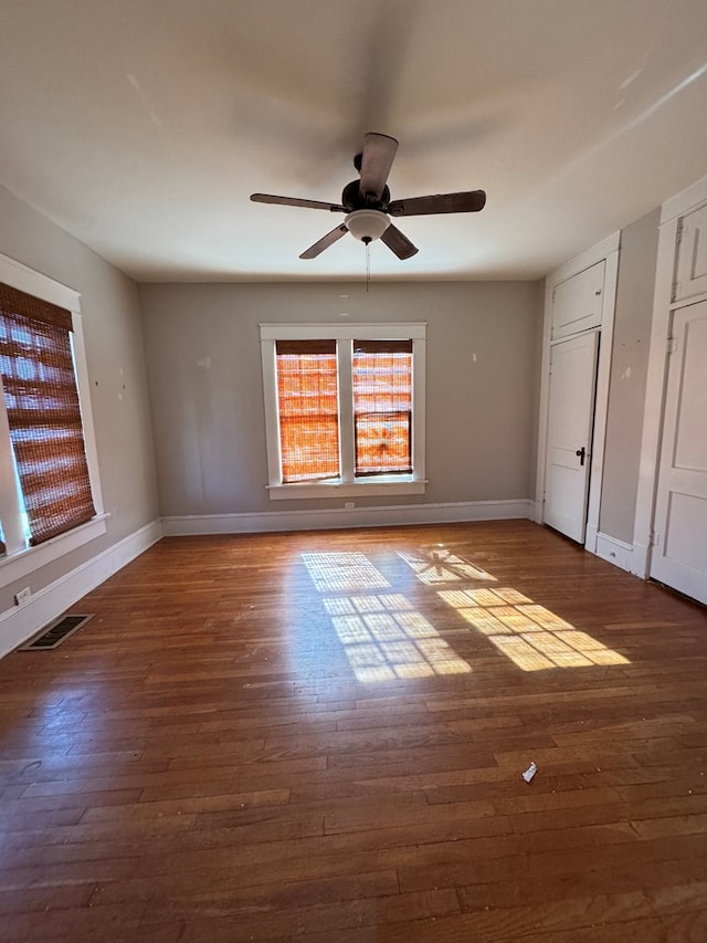 1912 29th St, Snyder, TX 79549 - unfurnished bedroom featuring ceiling fan and dark wood-type flooring