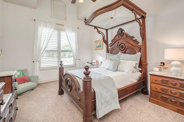 bedroom featuring light carpet and a ceiling fan